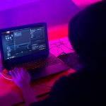 A gamer wearing a 'hoodie' uses a laptop computer at the Dreamhack digital festival in Moscow, Russia, on Saturday, Dec. 5, 2015. Dreamhack is the