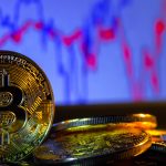 A golden bitcoin with keyboard and graph background. trading concept of crypto currency